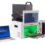 a model 615 laser enclosure with door open and tooling tray extended fitted with a Keyence laser marker with included laptop