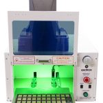 a model 615 laser enclosure with door open and tooling tray extended fitted with a Keyence laser marker
