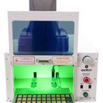 a model 615 laser enclosure with open door and tooling tray extracted fitted with a Keyence laser marker